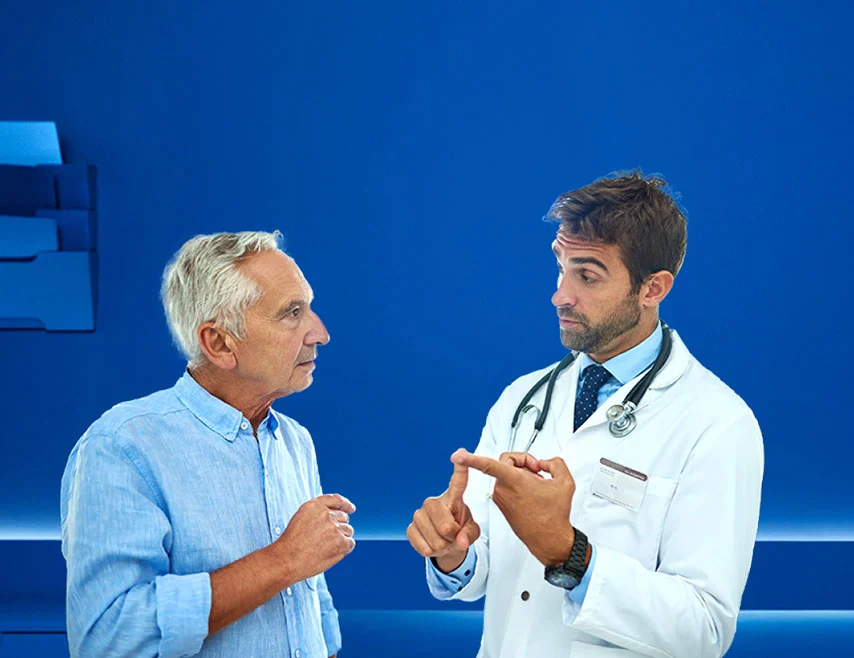 Actor portrayals of a doctor consulting with an older male patient