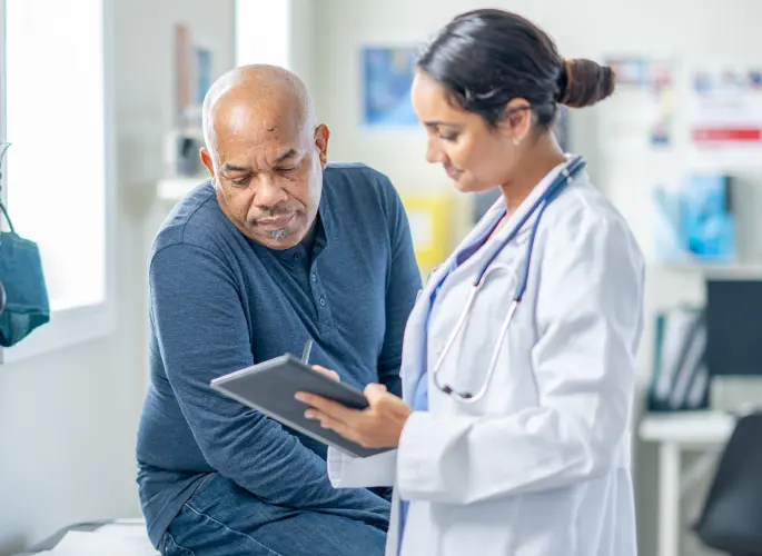 Actor portrayals of a doctor consulting a male patient